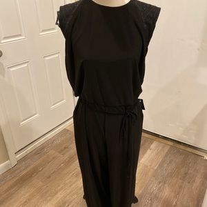 Brand New Black Jumpsuit with sequins on the top.